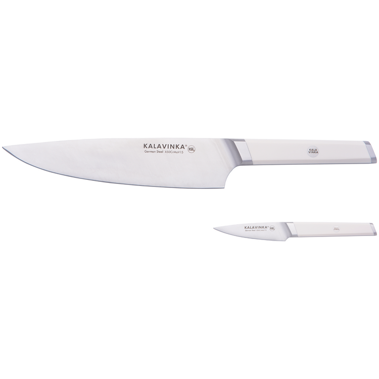 Two kitchen knives with white handles and silver blades. The larger knife has "KALAVINKA German Steel" written on it, and the smaller knife also features "KALAVINKA" text. Both knives have shiny metallic finishes.