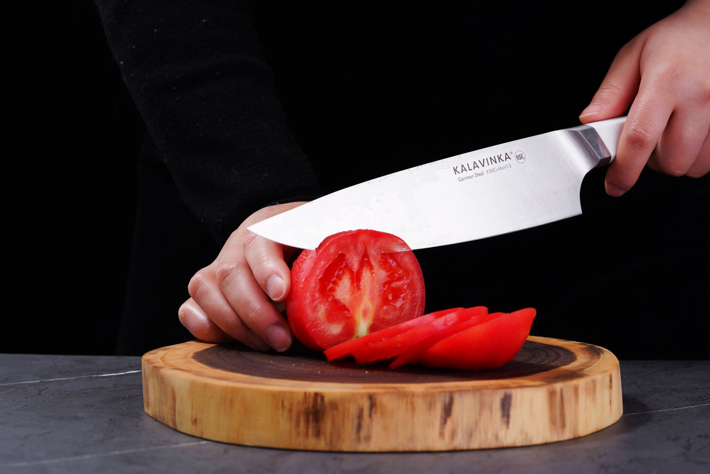 Using a Chef's Knife from a 2PC Knife Set, a person cuts a tomato with precision, showcasing the razor-sharp blade.